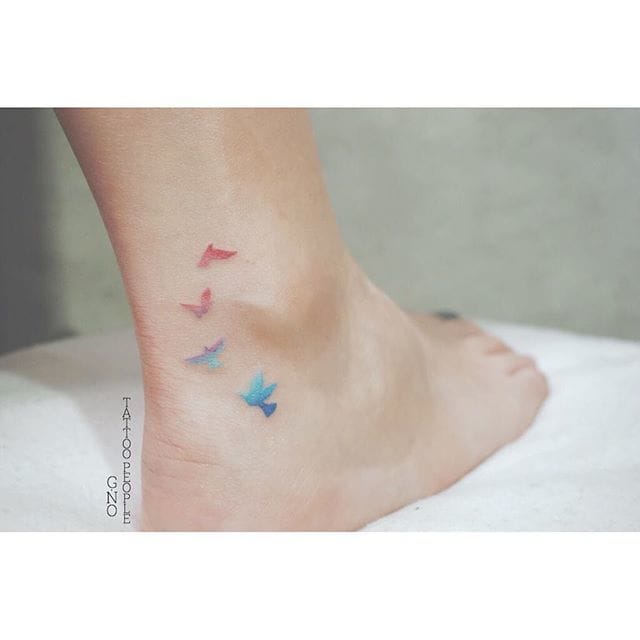 Minimalistic watercolor bird tattoo